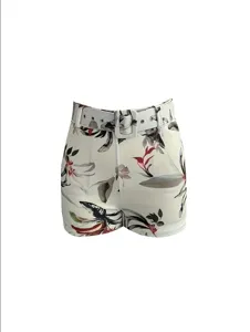 Women high waist botanical print shorts with matching belt, stylish casual summer wear.