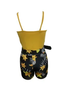 Back detail of the yellow strap top and floral print shorts set, showing the belt design.
