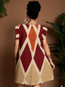 Detail shot showing the back geometric print and cut of the casual women's dress.
