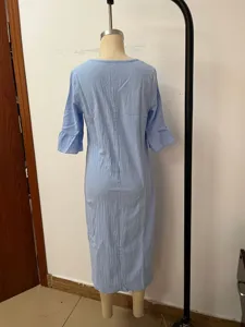Detail view of light blue linen blend midi dress featuring cute ruffle sleeves and simple back design.