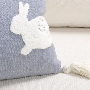 Detail shot of Easter rabbit throw pillow cover with tufted embroidery and tassel.