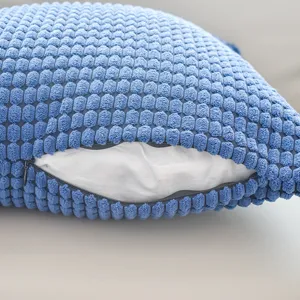 Blue corduroy throw pillow cover featuring corn grain texture and convenient zipper closure.