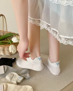 Detailed shot of cute Japanese style bow embroidered cotton short socks, soft and breathable.
