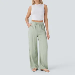 High-waist drawstring wide leg casual linen pants outfit detail view, comfortable beach wear.