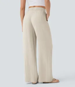 Back view detail of high waist drawstring casual wide leg linen pants with side pockets.
