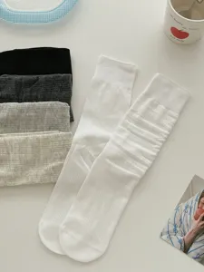 Detail view of ultra-thin mesh slouch socks, breathable spring summer solid color mid-calf hosiery.