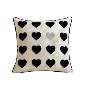 Decorative pillow cover with black and silver heart embroidery, soft velvet style, square.