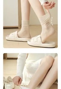 Close-up of thin ribbed crew socks worn with sandals, soft cotton material, breathable style.