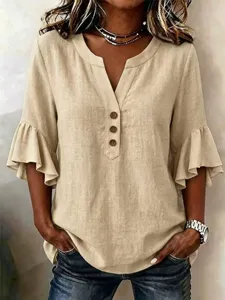 Close-up detail of casual linen V-neck blouse featuring elegant ruffle flare sleeves and buttons.