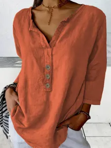 Detailed view of a casual orange notch collar button-down long sleeve shirt for women's daily wear.