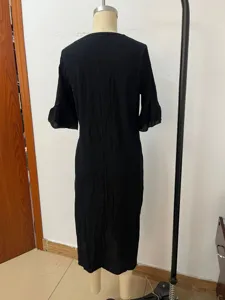 Back view detail of the black cotton linen dress showing the elegant silhouette and design.