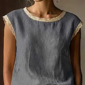 Detail shot of women's grey linen top featuring delicate cream lace trim along the round neck.