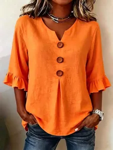 Orange cotton linen V-neck blouse with big buttons and ruffled sleeves for women detail.