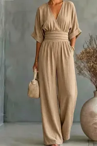 Detailed close-up view of the elegant khaki V-neck jumpsuit with a chic waist design.