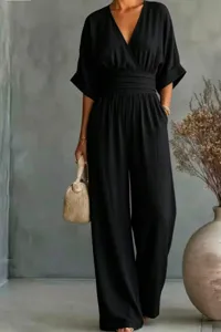 Black V-neck short sleeve jumpsuit detail, chic cinched waist and wide leg design.