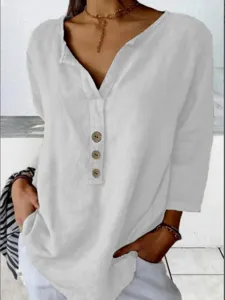 Detail view of the women casual white notch neck long sleeve blouse with wooden buttons.