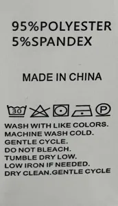 Detailed view of the clothing care wash label showing 95% polyester 5% spandex fabric info.