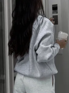 Casual grey stand collar long sleeve sweatshirt for women, versatile and stylish daily wear.
