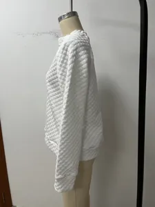 White quilted long sleeve women sweatshirt detail view, casual solid color pullover top.