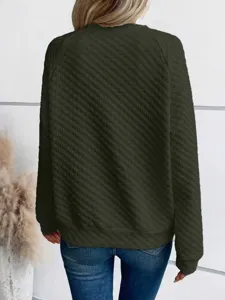 Detailed view of the dark green quilted long sleeve sweatshirt fabric texture and back lifestyle shot.
