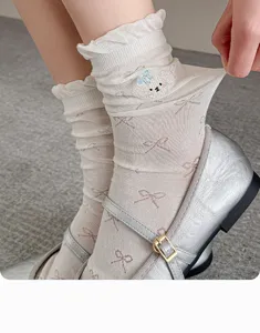 Detail view of women summer thin mesh stack socks featuring cute embroidery and bow patterns.