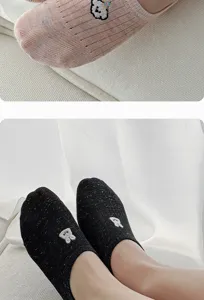 Close-up of breathable mesh summer boat socks featuring cute cartoon embroidery, low-cut.