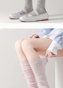 Detailed view of spring summer knit leg warmers, hollow breathable mesh slouch socks.