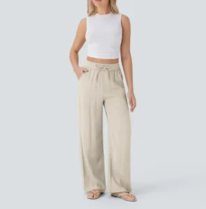 High-waist casual wide-leg linen pants with drawstring pockets, flowing beach trousers.