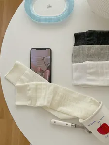 Thin breathable mesh solid color stack socks detail view showing fabric texture and soft tones.