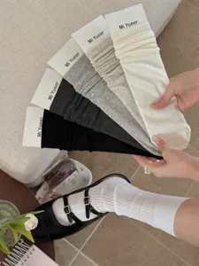 Detailed view of thin breathable mesh stack socks, casual solid color Korean style leg warmers.