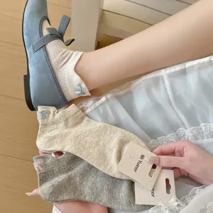 Cute Japanese style cotton short socks featuring sweet bow embroidery for women and girls daily wear.