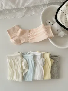 Detail shot of ultra-thin Japanese style mesh stirrup socks and half palm stacking socks.