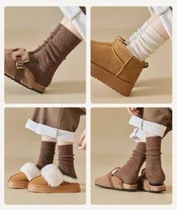 Close-up detail view of women's warm winter ribbed knit wool slouch socks in cozy brown.