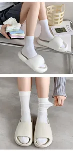White cotton mid-tube socks for women, solid color thin breathable casual daily wear.