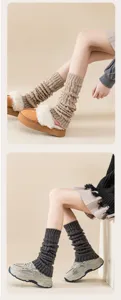 Detail view of knitted leg warmers showing cozy winter warmth and Y2K JK style texture.