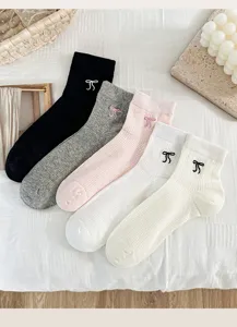 Detailed view of summer women mesh socks with cute bow embroidery, breathable cotton fabric.