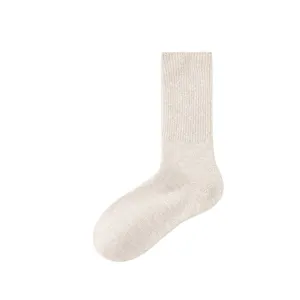 Womens thick warm wool cashmere mid tube slouch socks for autumn and winter daily wear.