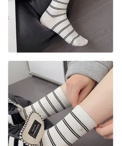 Cute white cotton mid-calf socks featuring black stripes and delicate details for daily wear.