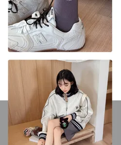 Detailed view of college style mid-tube cotton socks paired with casual sneakers and outfit.