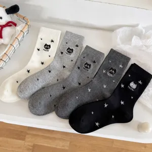 Cute women's mid-calf cotton socks featuring adorable cat embroidery and star patterns for daily wear.