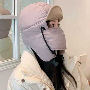 Winter windproof ushanka hat with integrated face mask detail shot showing soft fleece and buckle.