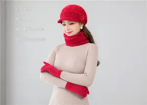 Detailed view of women winter red knit hat scarf and gloves set for cold weather warmth.