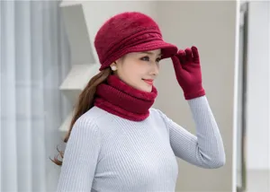Close-up detail of women winter fleece thermal knit hat scarf and gloves set in red.