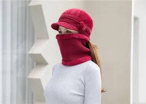 Detailed view of the women winter fleece lined warm knitted hat and cozy scarf set in red.