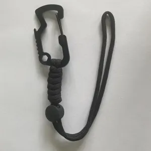 Detailed view of the black multi-functional paracord carabiner and adjustable wrist strap.