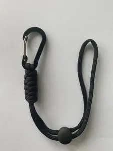Black paracord lanyard with carabiner and cord lock, versatile outdoor bag strap accessory.