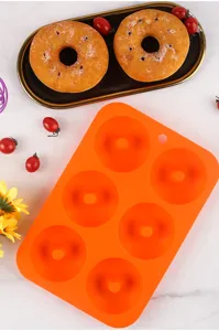 Orange 6-cavity silicone donut baking mold detail view, flexible non-stick cake pan DIY tool.
