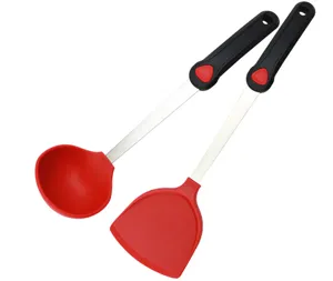 Red silicone kitchen utensil detail featuring a heat-resistant ladle and spatula set.