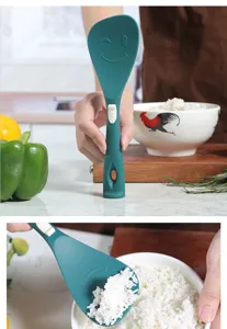 Silicone rice paddle kitchenware detail view showing high temperature non-stick spoon with smile.