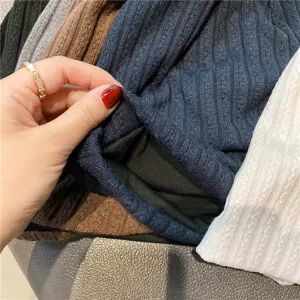 Close-up view of soft ribbed sleep cap interior lining, breathable fabric texture details.